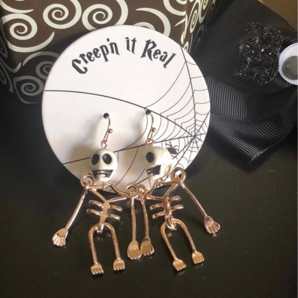 Francesca's Rose Gold Skeleton Earrings